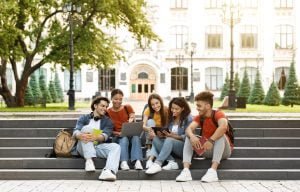 Students sitting on steps at university