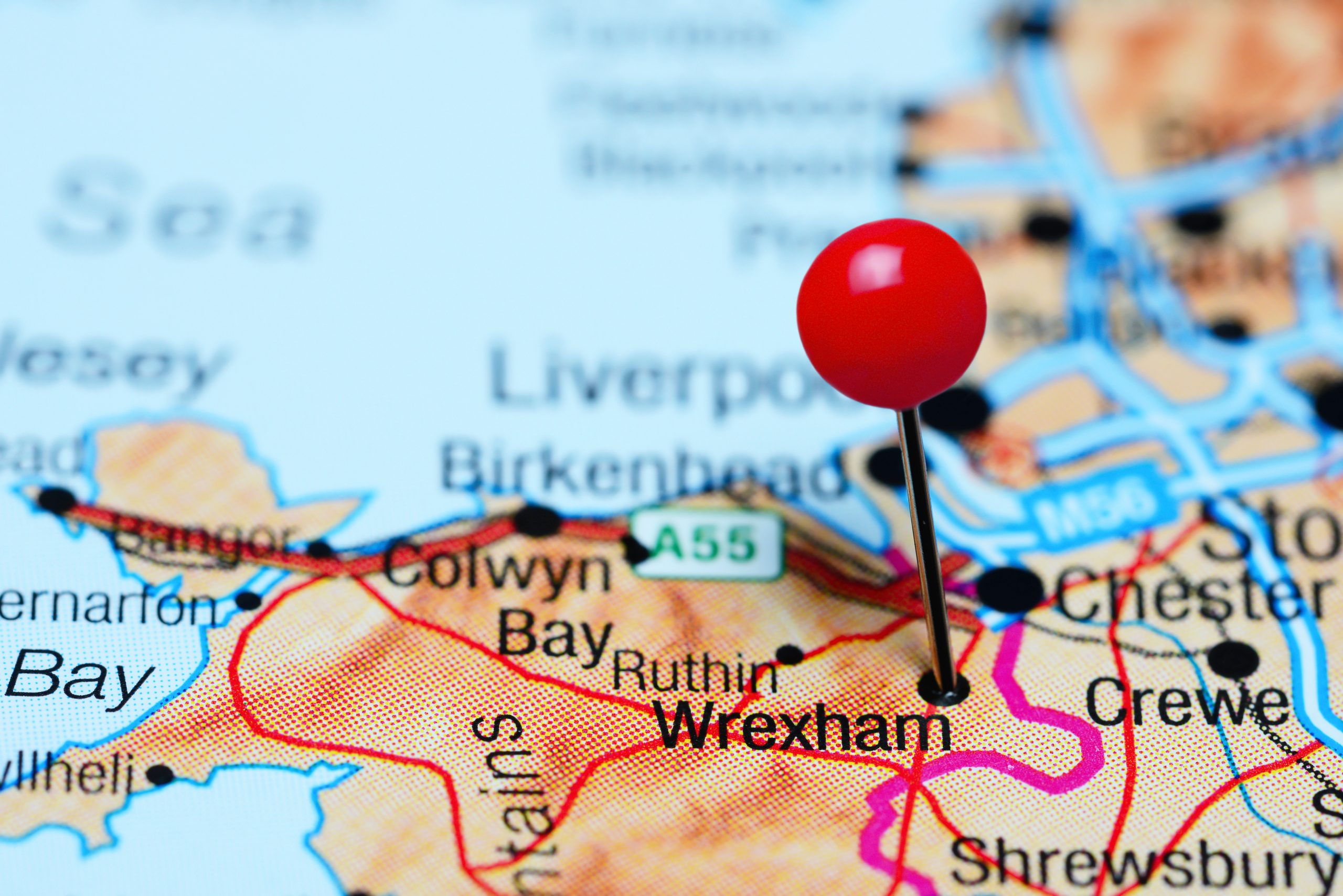 Map of Wales with a pin pointing to Wrexham